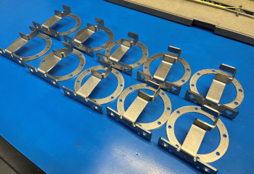 A set of small precision sheet metal ring holders
