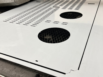 A door for a custom large-scale precision sheet metal enclosure punched on our Amada AC255-NT CNC punch